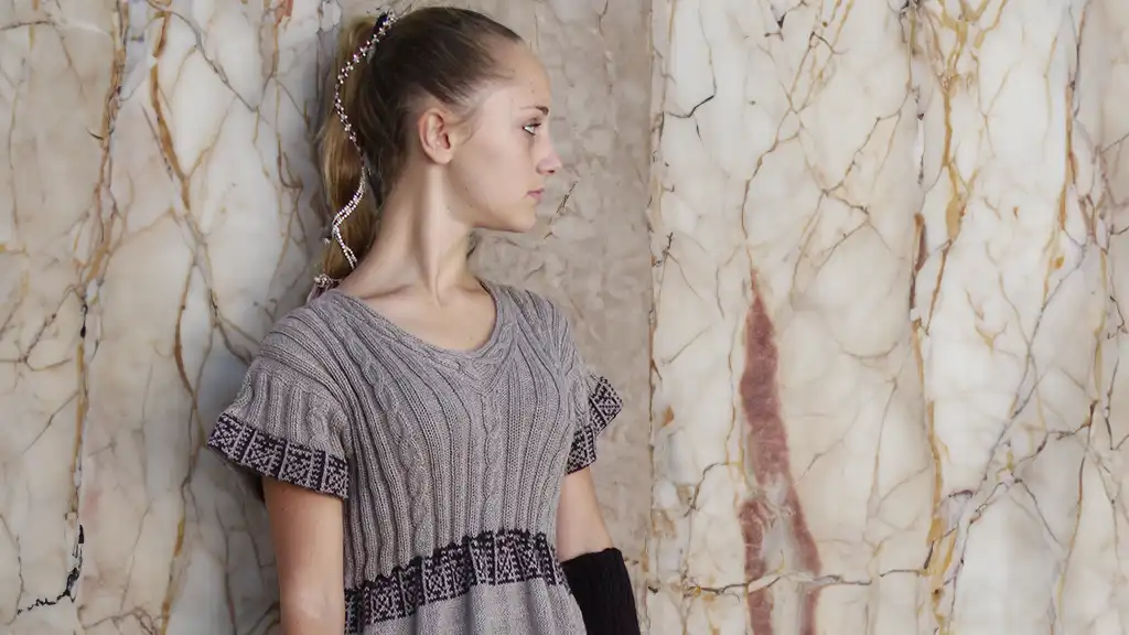 Winter bohemian dresses Bohemian dresses for winter: beautiful blonde girl in a gorgeous half-sleeved dress made of alpaca wool