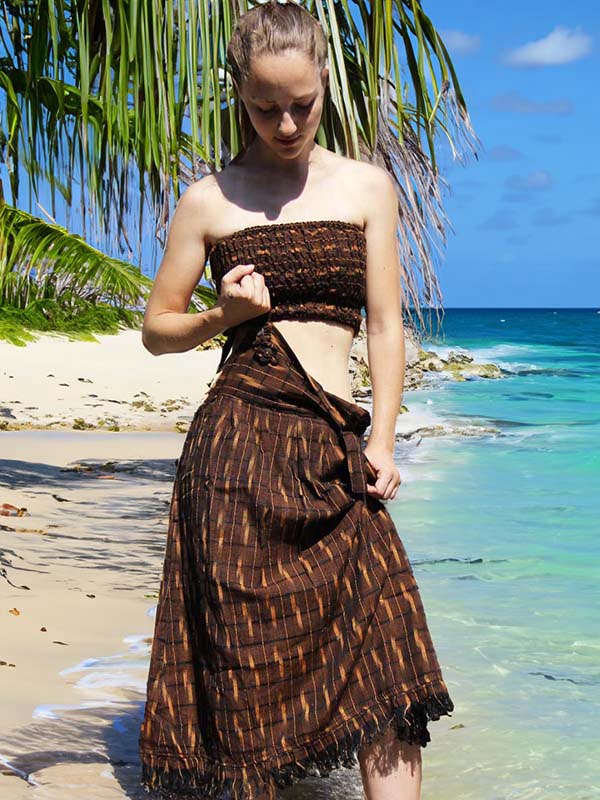 Women's Pinafore Dress Women's Pinafore Dress: young woman wearing a dungarees skirt by the sea