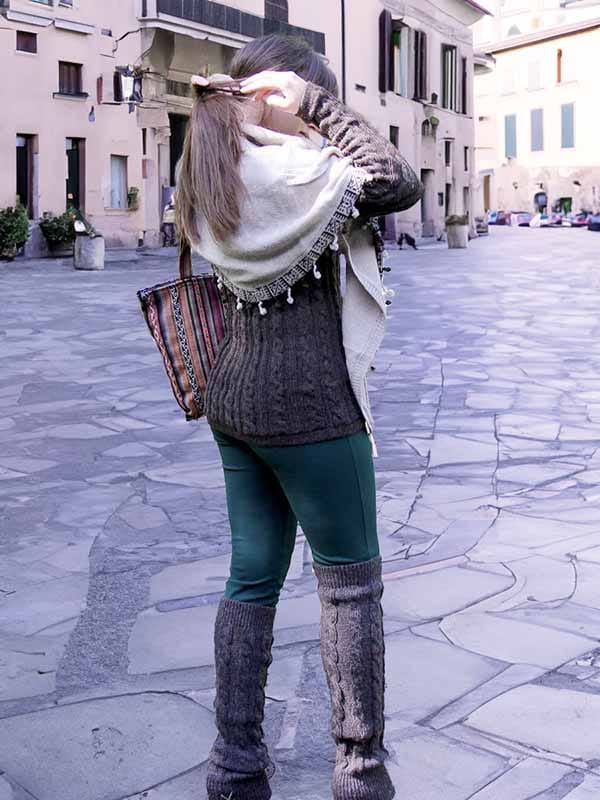 Alpaca wool sweaters outfit - Peruvian Alpaca Sweaters: Woman with a winter outfit in shades of brown and beige: sweater, triangular scarf, leg warmers and bag in ethnic boho style