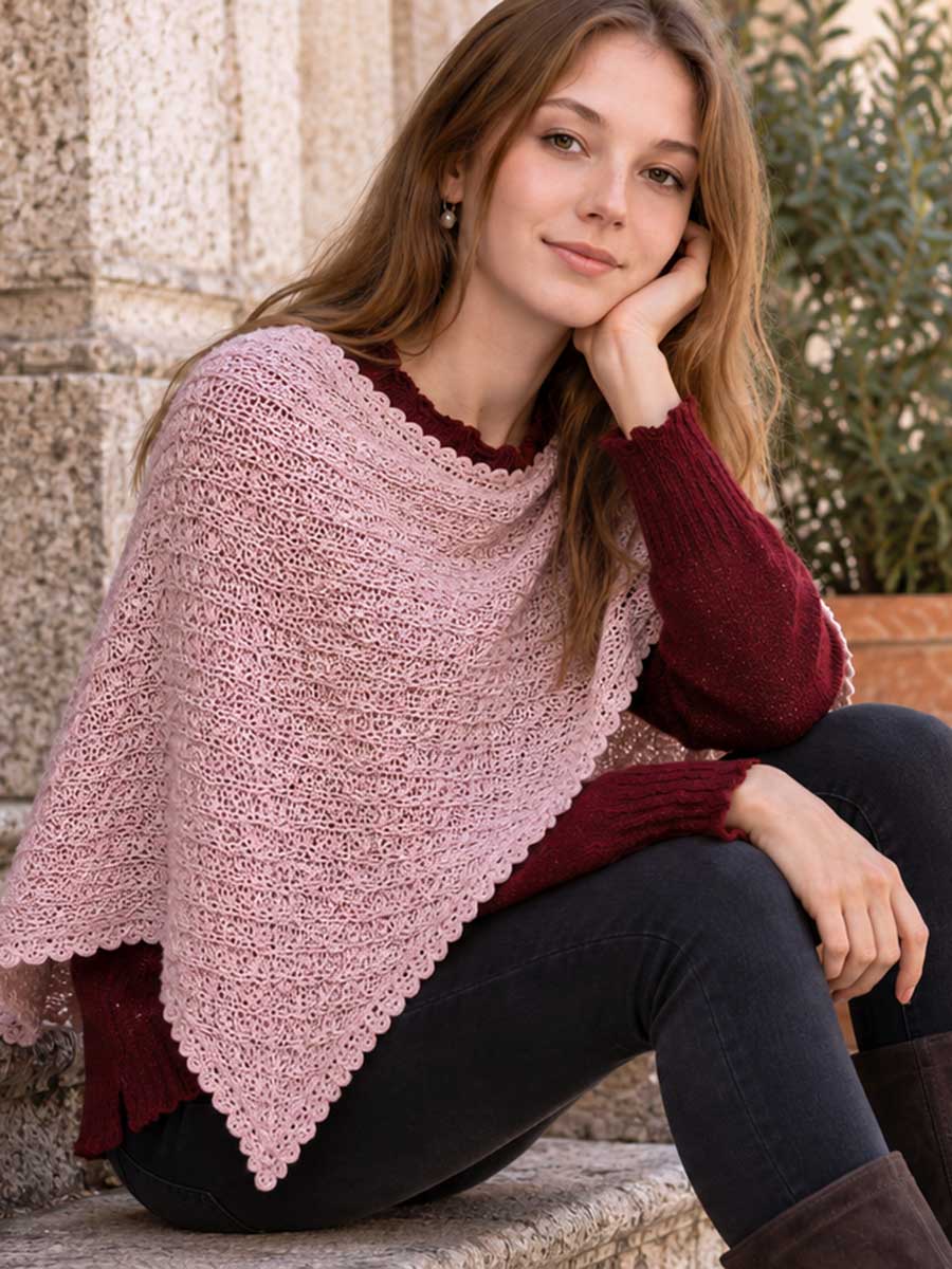 Lightweight poncho with burgundy jumper for autumn Woman wearing a dusty pink lightweight poncho over a burgundy jumper
